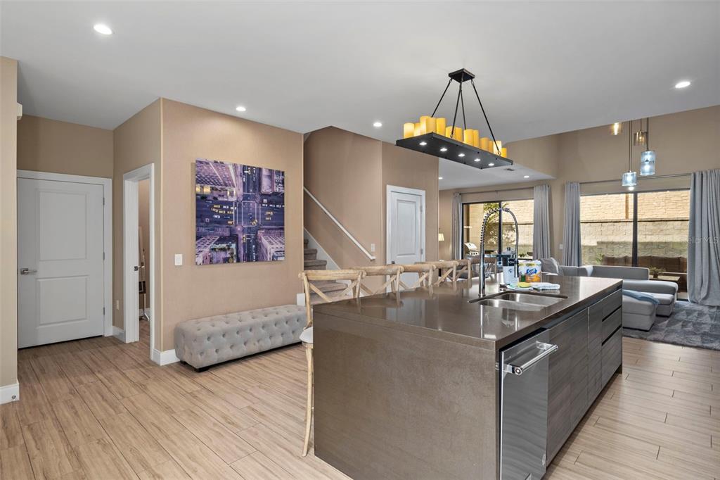 3099 Rockefeller Way Kissimmee, FL 34747 - Photo 8 of 54 a very nice looking living room with a large window and chandelier