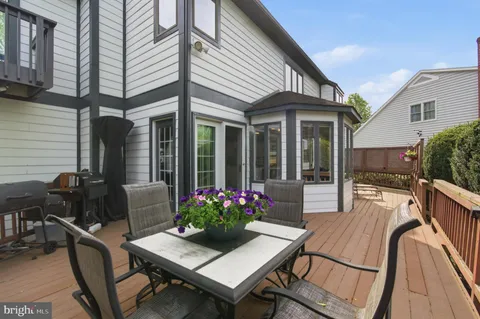 a bathroom with a sink mirror vanity and toilet