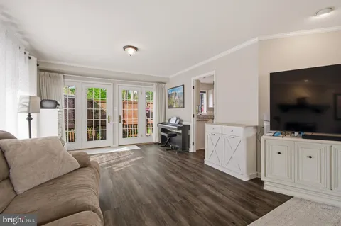 a living room with furniture fireplace and a window