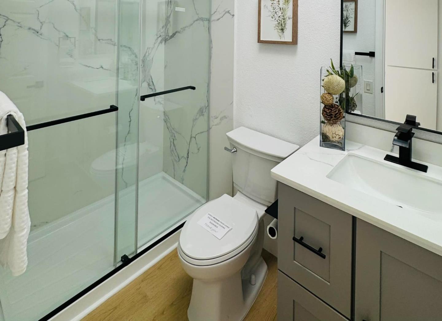 1213 Lightland Road San Jose, CA 95121 - Photo 11 of 16 a bathroom with a sink toilet and shower