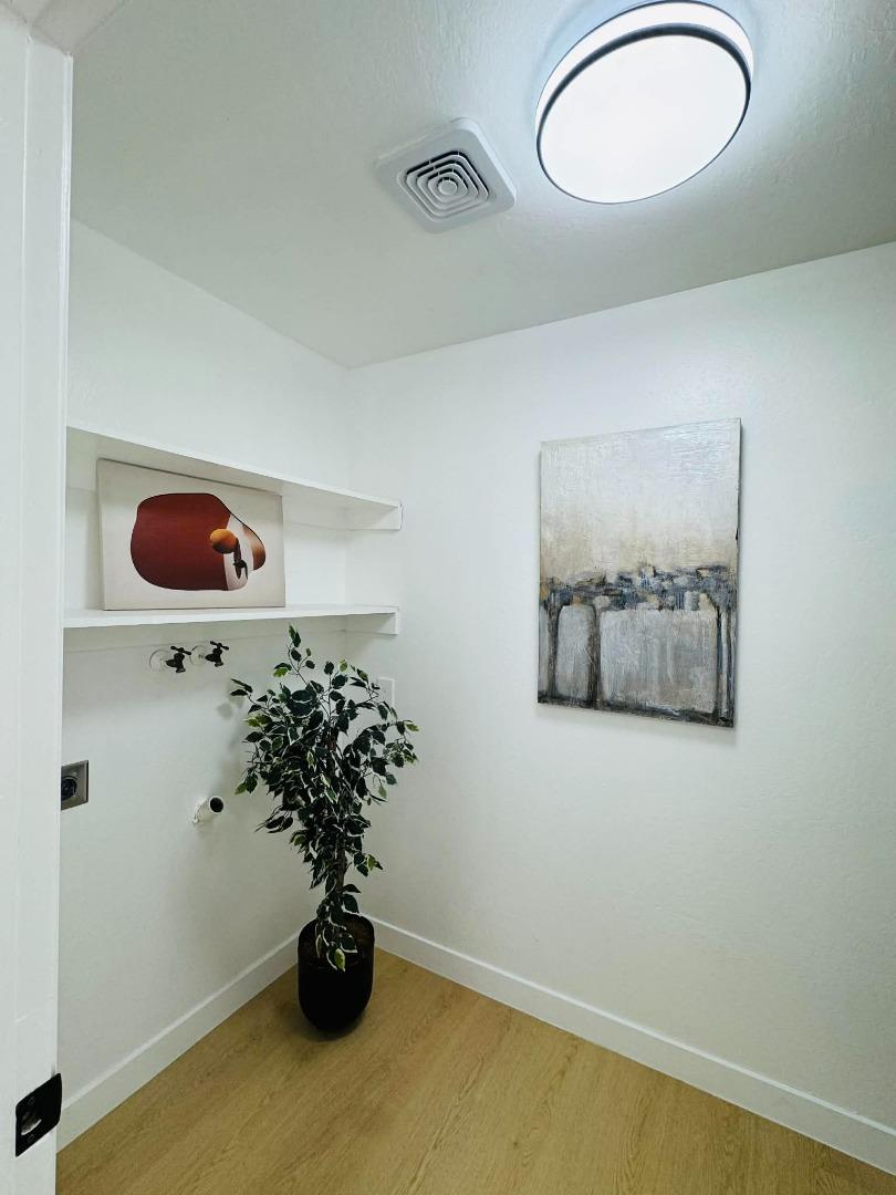 1213 Lightland Road San Jose, CA 95121 - Photo 15 of 16 a vase of flowers sitting on a table