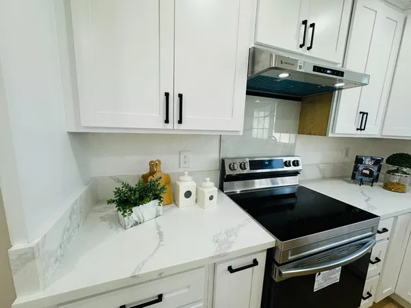 a kitchen with a sink and cabinets