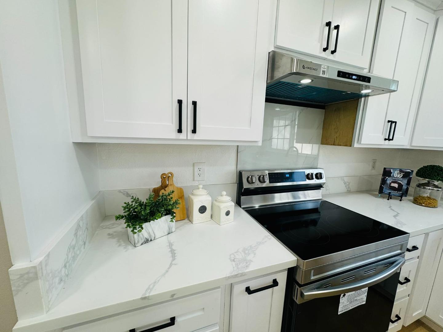1213 Lightland Road San Jose, CA 95121 - Photo 4 of 16 a kitchen with a sink and cabinets