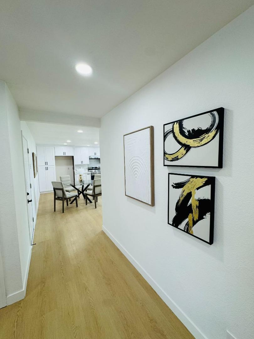 1213 Lightland Road San Jose, CA 95121 - Photo 7 of 16 a view of a livingroom with furniture and a potted plant