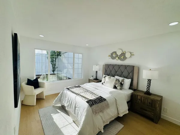 a bed room with a bed and a couch