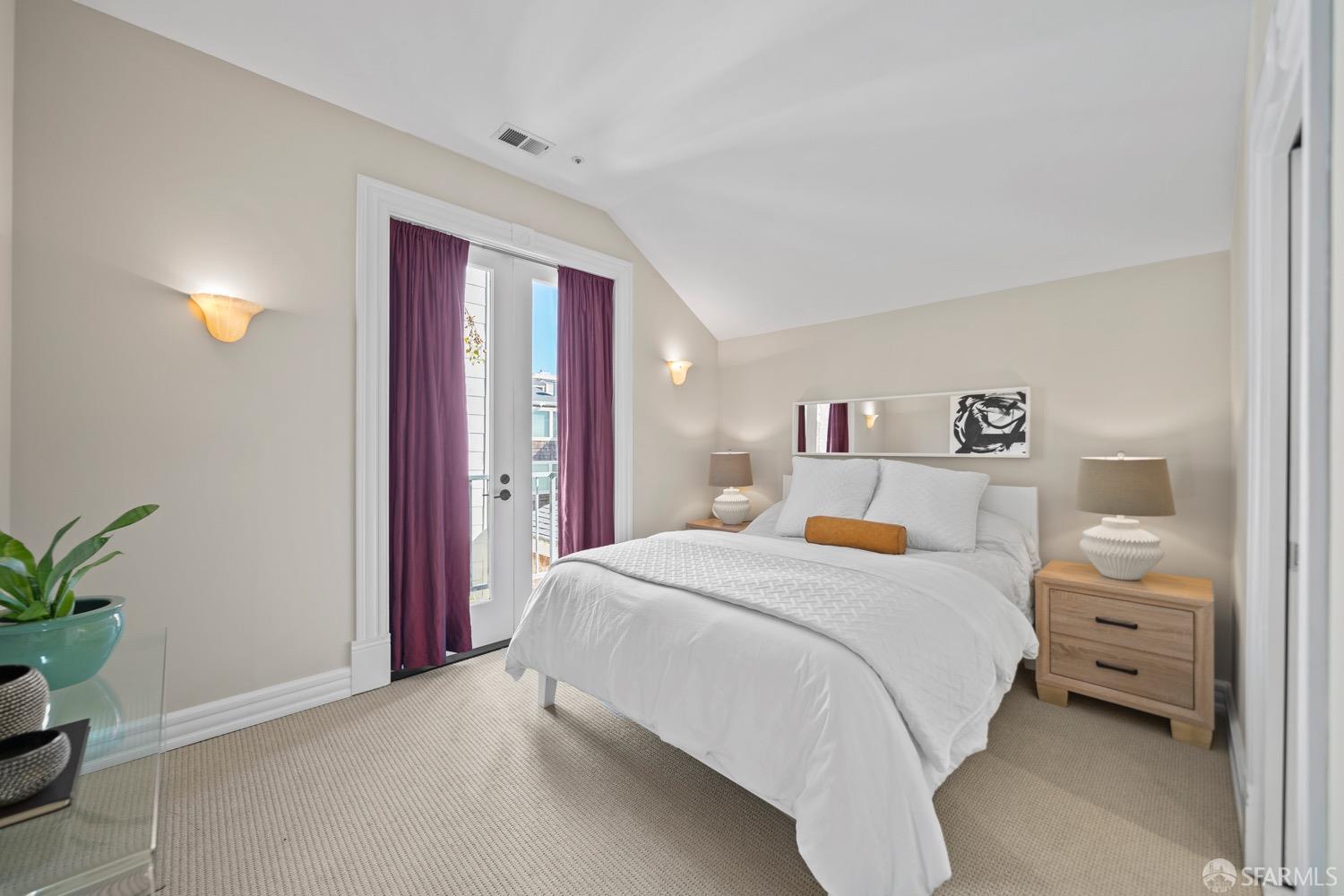 1 Cottage Row San Francisco, CA 94115 - Photo 12 of 52 a bedroom with a bed and a potted plant