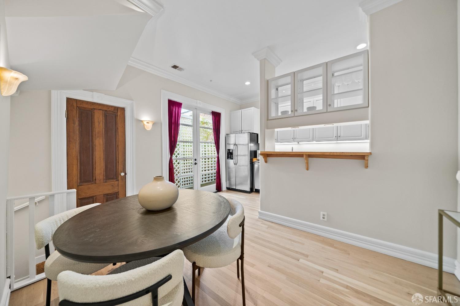 1 Cottage Row San Francisco, CA 94115 - Photo 25 of 52 a dining room with furniture and wooden floor