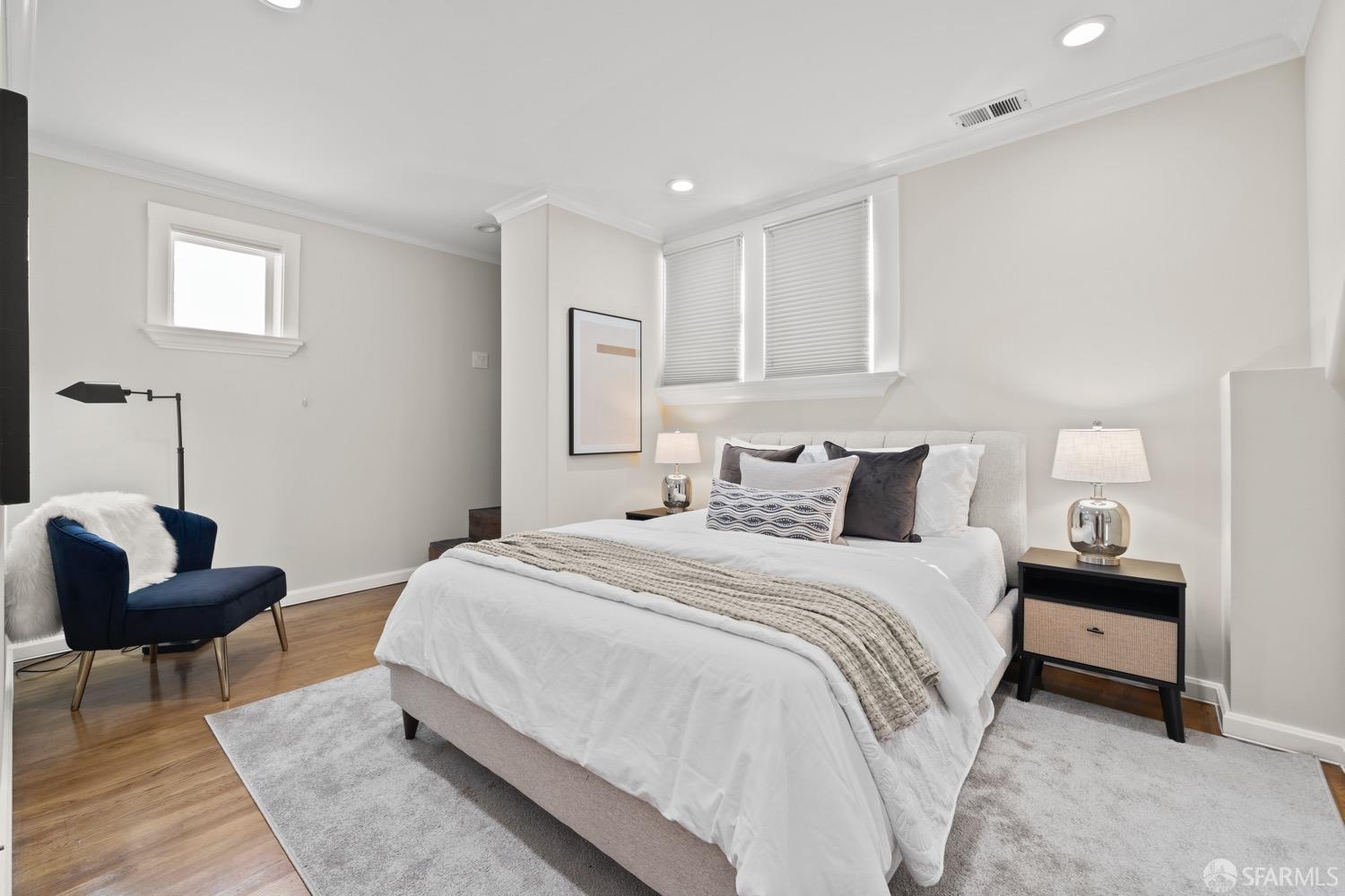 1 Cottage Row San Francisco, CA 94115 - Photo 26 of 52 a bedroom with a bed and a couch