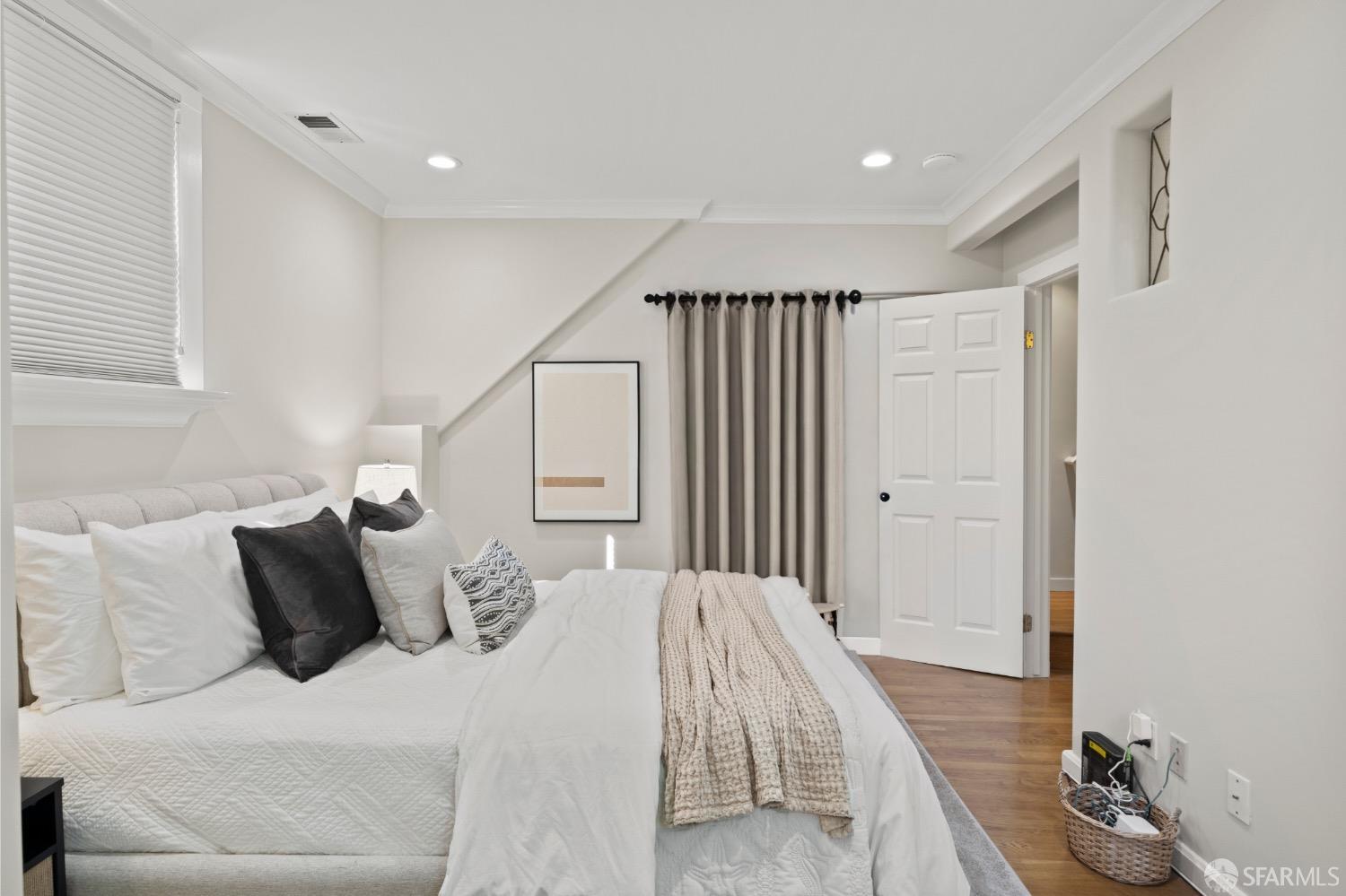 1 Cottage Row San Francisco, CA 94115 - Photo 27 of 52 a bedroom with a bed and a couch