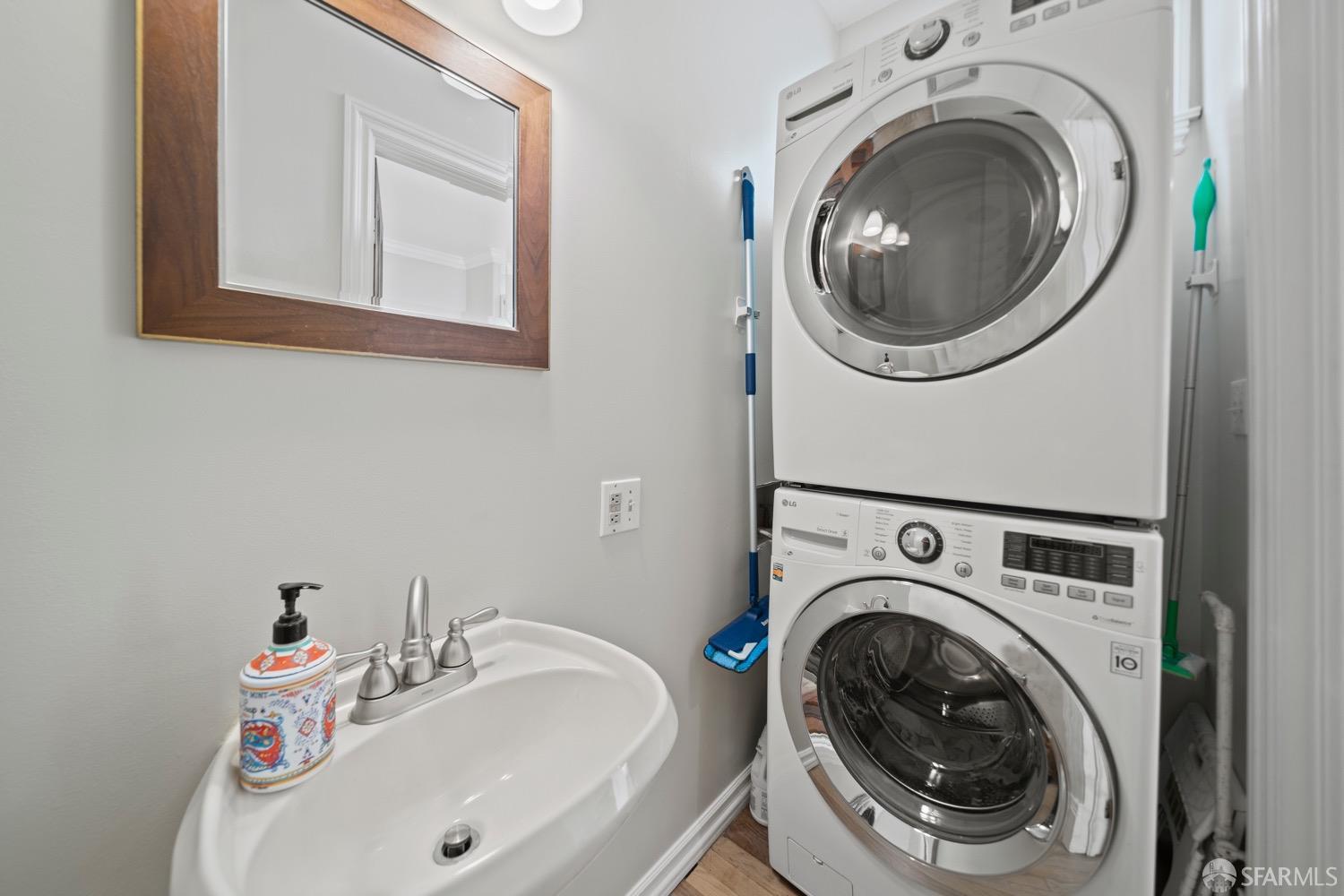 1 Cottage Row San Francisco, CA 94115 - Photo 34 of 52 a bathroom with a sink and a washer dryer
