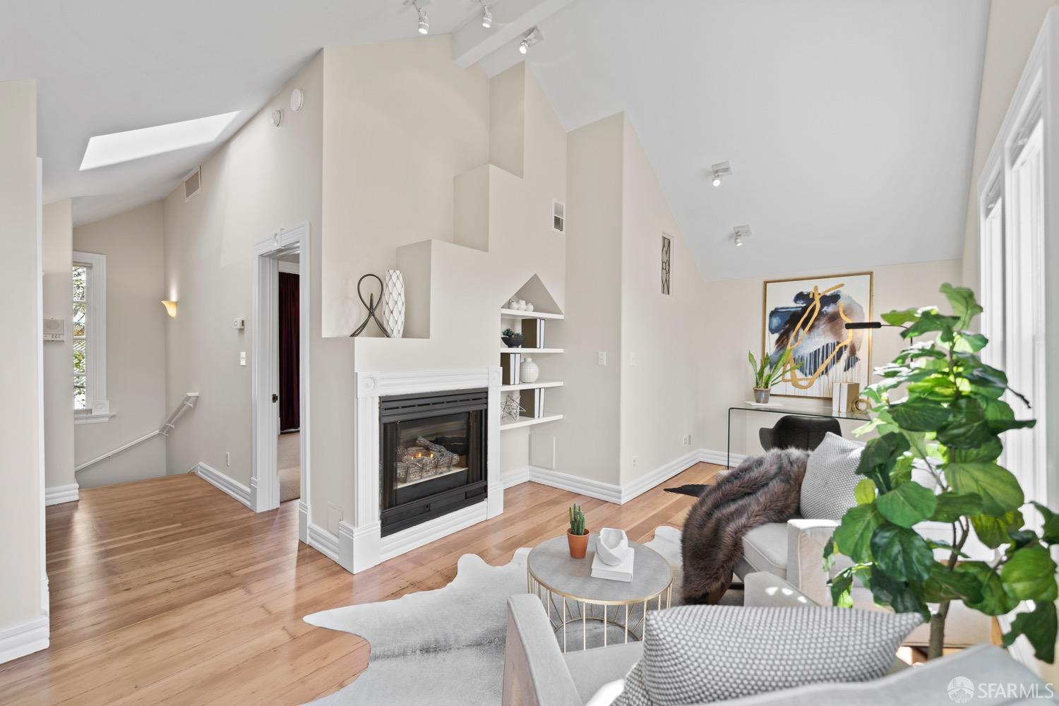1 Cottage Row San Francisco, CA 94115 - Photo 7 of 52 a living room with furniture fireplace and potted plant