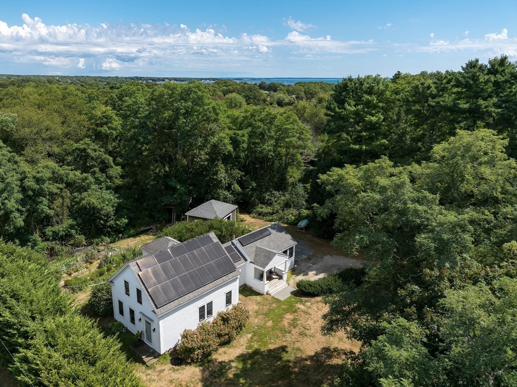 86 Fairhaven Road Mattapoisett, MA 02739 - Photo 1 of 40 an aerial view of a house with a yard