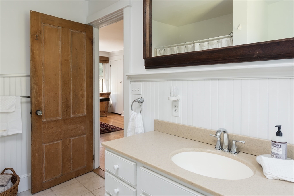 86 Fairhaven Road Mattapoisett, MA 02739 - Photo 14 of 40 a bathroom with a sink and a mirror