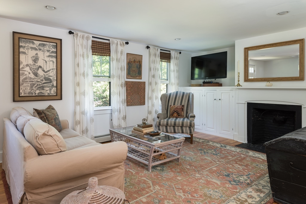 86 Fairhaven Road Mattapoisett, MA 02739 - Photo 15 of 40 a living room with furniture a flat screen tv and a fireplace