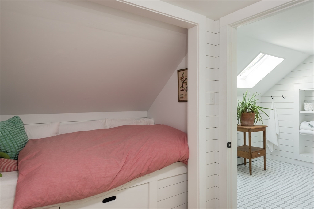 86 Fairhaven Road Mattapoisett, MA 02739 - Photo 23 of 40 a bedroom with a bed and a table