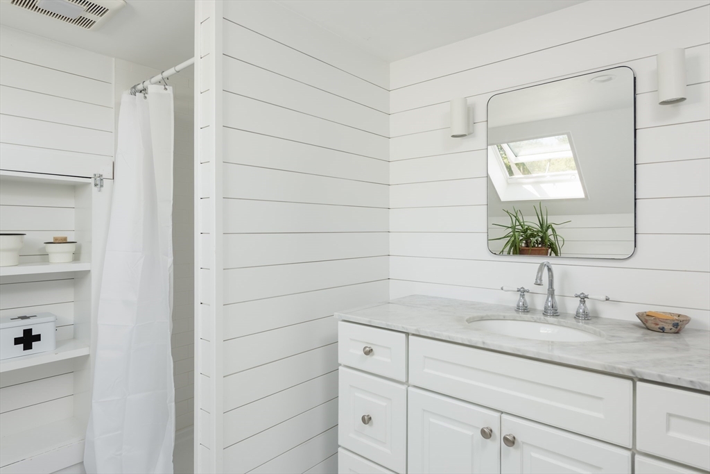 86 Fairhaven Road Mattapoisett, MA 02739 - Photo 24 of 40 a bathroom with a sink and a mirror