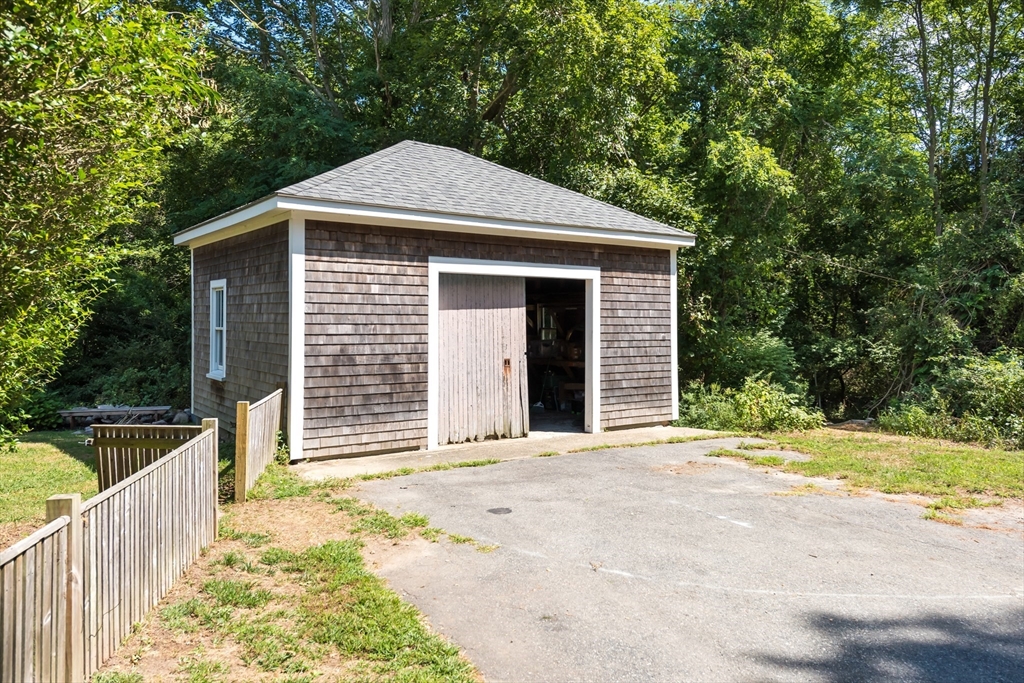 86 Fairhaven Road Mattapoisett, MA 02739 - Photo 27 of 40 a front view of a house with a yard