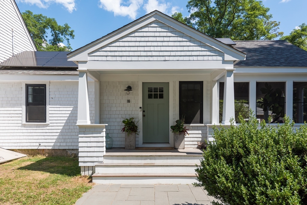 86 Fairhaven Road Mattapoisett, MA 02739 - Photo 3 of 40 a view of a house with entrance stairs and a yard