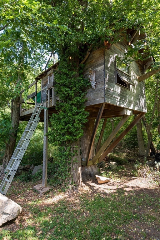 86 Fairhaven Road Mattapoisett, MA 02739 - Photo 32 of 40 a backyard of a house with lots of green space