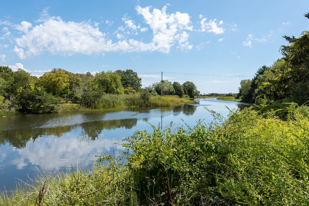 86 Fairhaven Road Mattapoisett, MA 02739 - Photo 36 of 40 a view of a lake with houses in the back