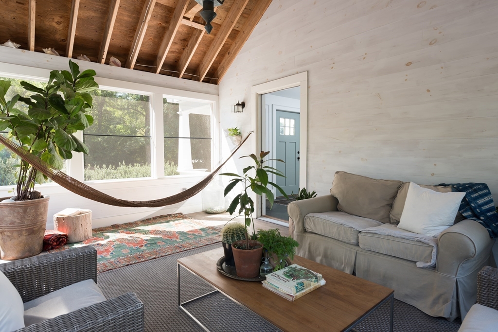 86 Fairhaven Road Mattapoisett, MA 02739 - Photo 8 of 40 a living room with a couch and a potted plant