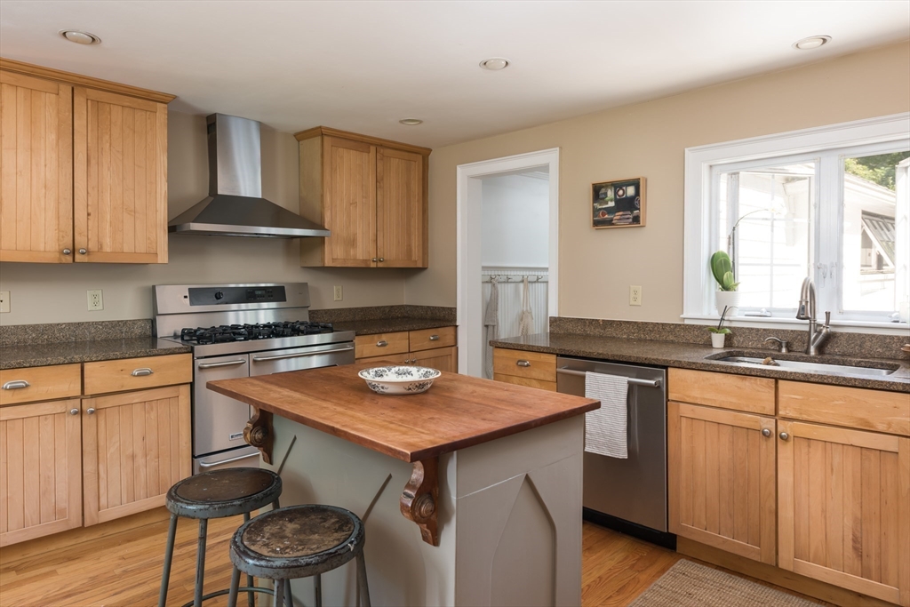 86 Fairhaven Road Mattapoisett, MA 02739 - Photo 10 of 40 a kitchen with a sink cabinets and wooden floor