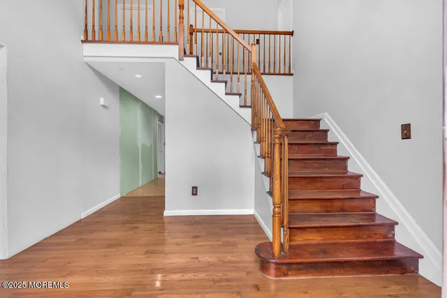 a view of entryway with wooden floor