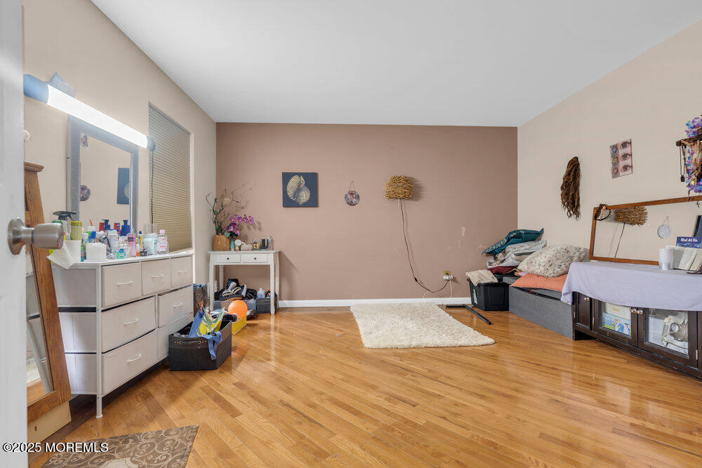 886 Green Valley Road Jackson, NJ 08527 - Photo 5 of 20 a bed room with a bed and a couch