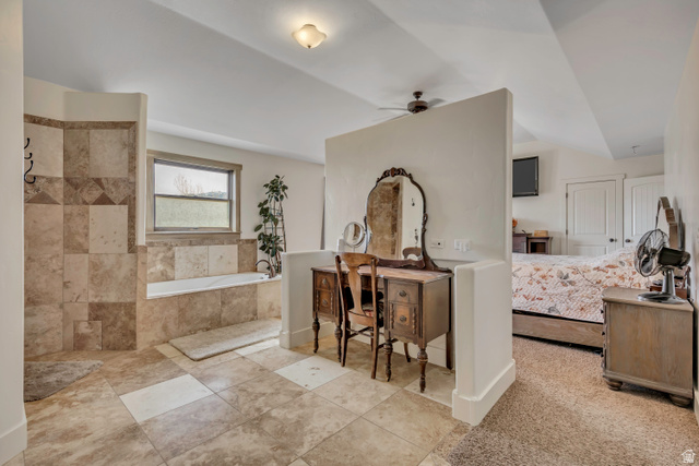 3054 West Ridgeline Road Stockton, UT 84071 - Photo 18 of 88 Full bathroom with a bath, ensuite bath, ceiling fan, vanity, and lofted ceiling
