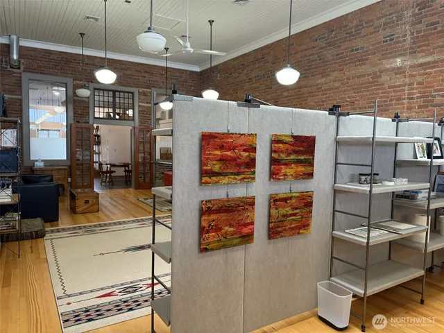 a kitchen with stainless steel appliances kitchen island granite countertop a stove and cabinets