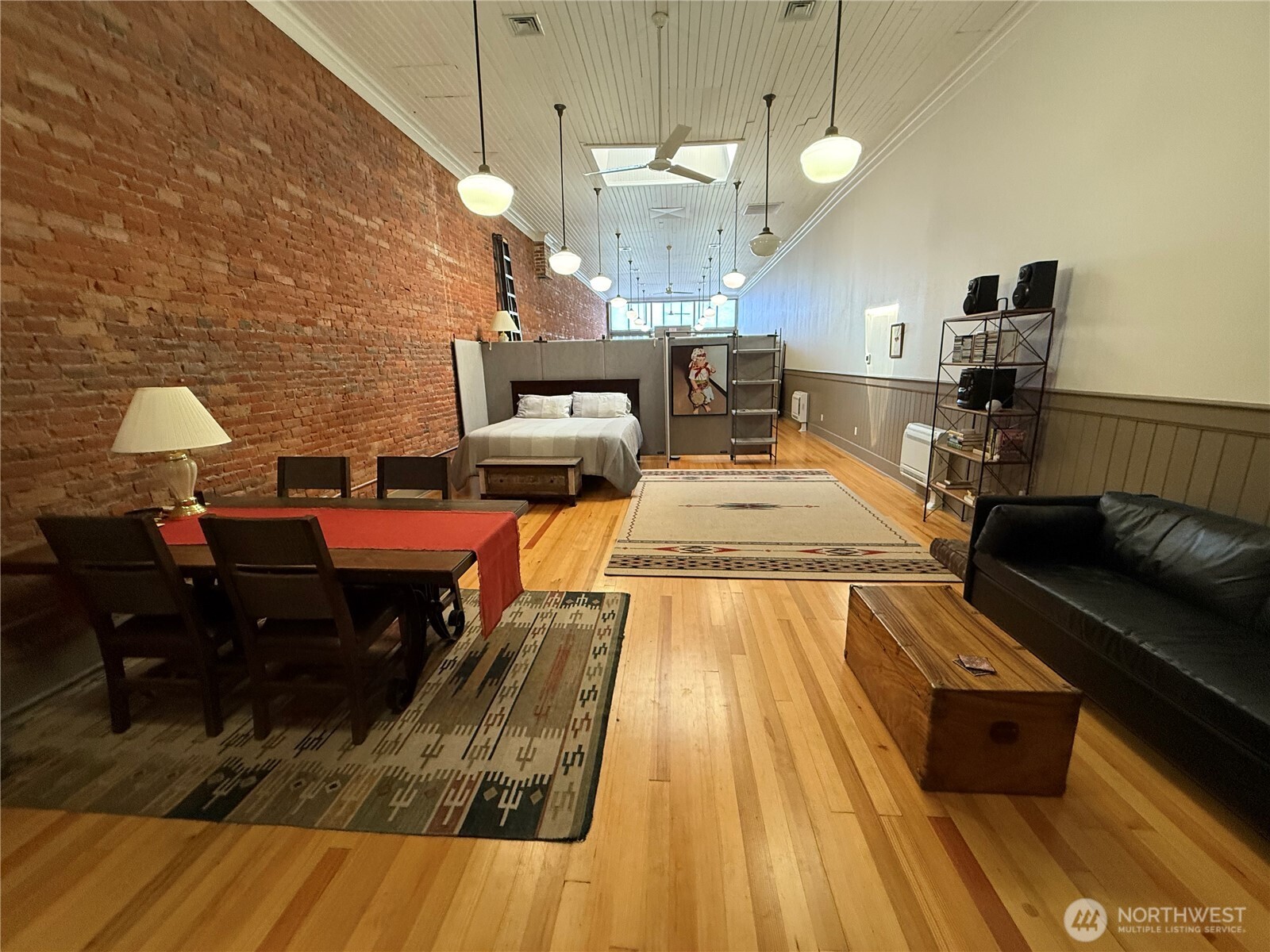 250 East Main Street Dayton, WA 99328 - Photo 13 of 33 a living room with furniture and a chandelier