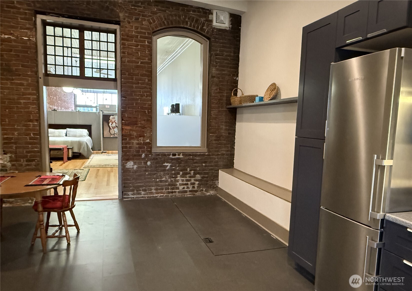 250 East Main Street Dayton, WA 99328 - Photo 16 of 33 a view of living room and kitchen with furniture wooden floor and window