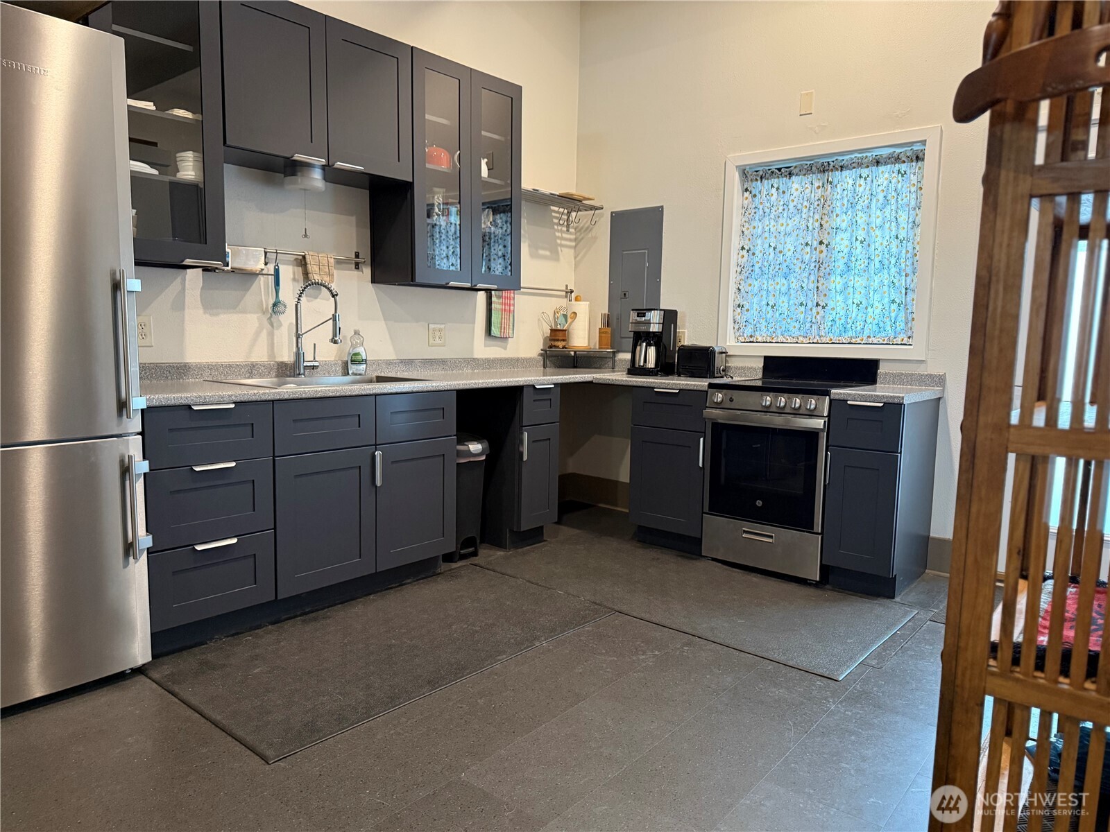 250 East Main Street Dayton, WA 99328 - Photo 19 of 33 a kitchen with stainless steel appliances granite countertop a refrigerator a sink a stove a microwave and wooden cabinets