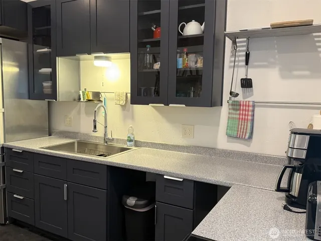 a kitchen with a stove and a cabinet