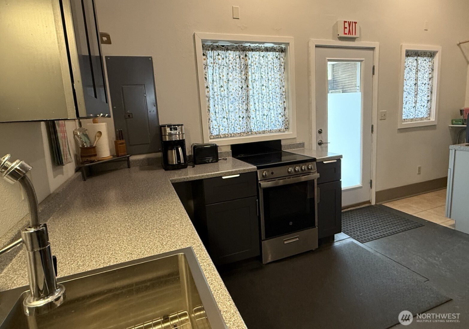 250 East Main Street Dayton, WA 99328 - Photo 22 of 33 a view of a kitchen with fridge and wooden floor