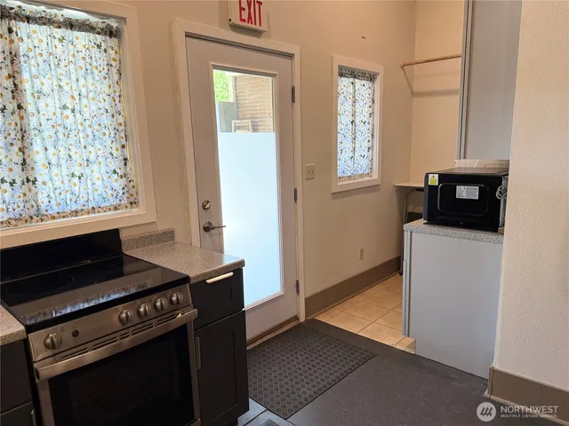 a kitchen with a stove and a microwave