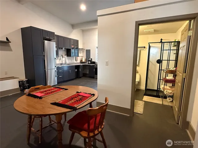 a bathroom with a toilet a sink and a mirror