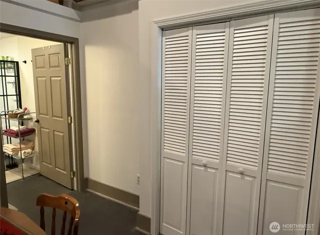 a view of a hardwood floor and an empty room