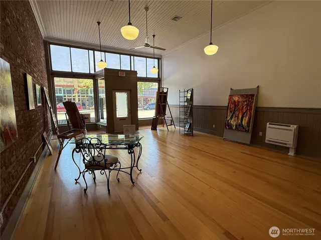 a view of a dining room with furniture window and wooden floor