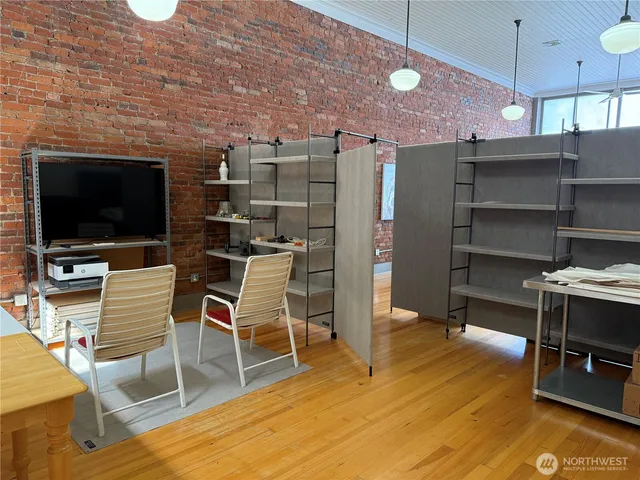 a room with wooden furniture and a flat screen tv