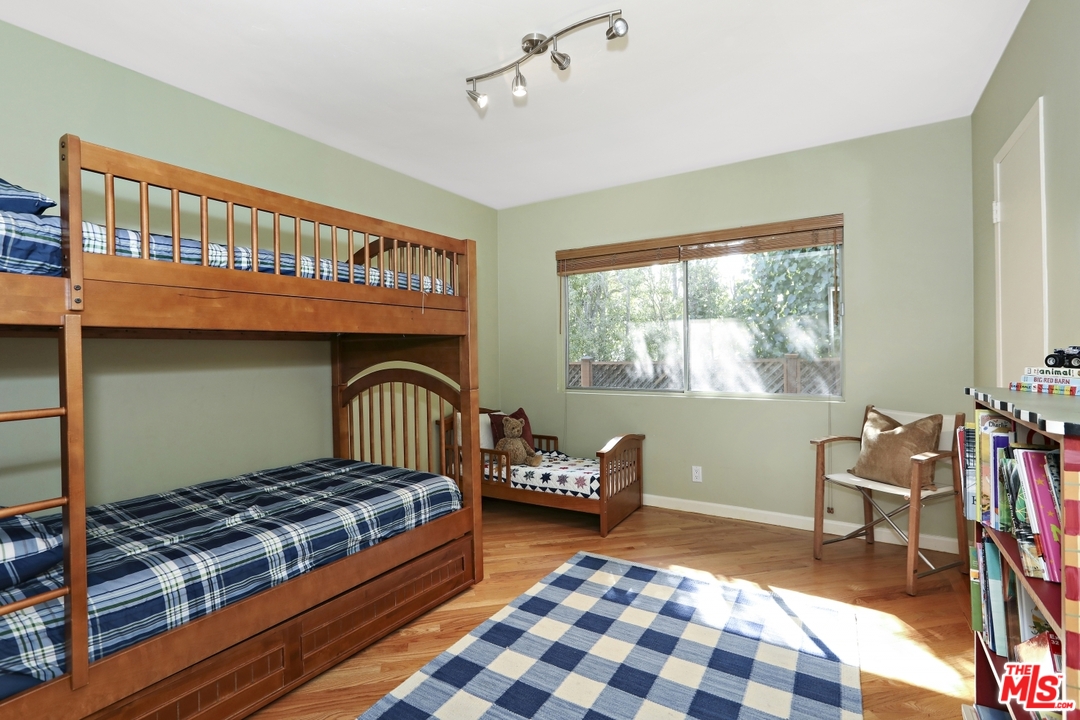 1629 Tower Grove Drive Beverly Hills, CA 90210 - Photo 18 of 29 a bedroom with a bed and a window