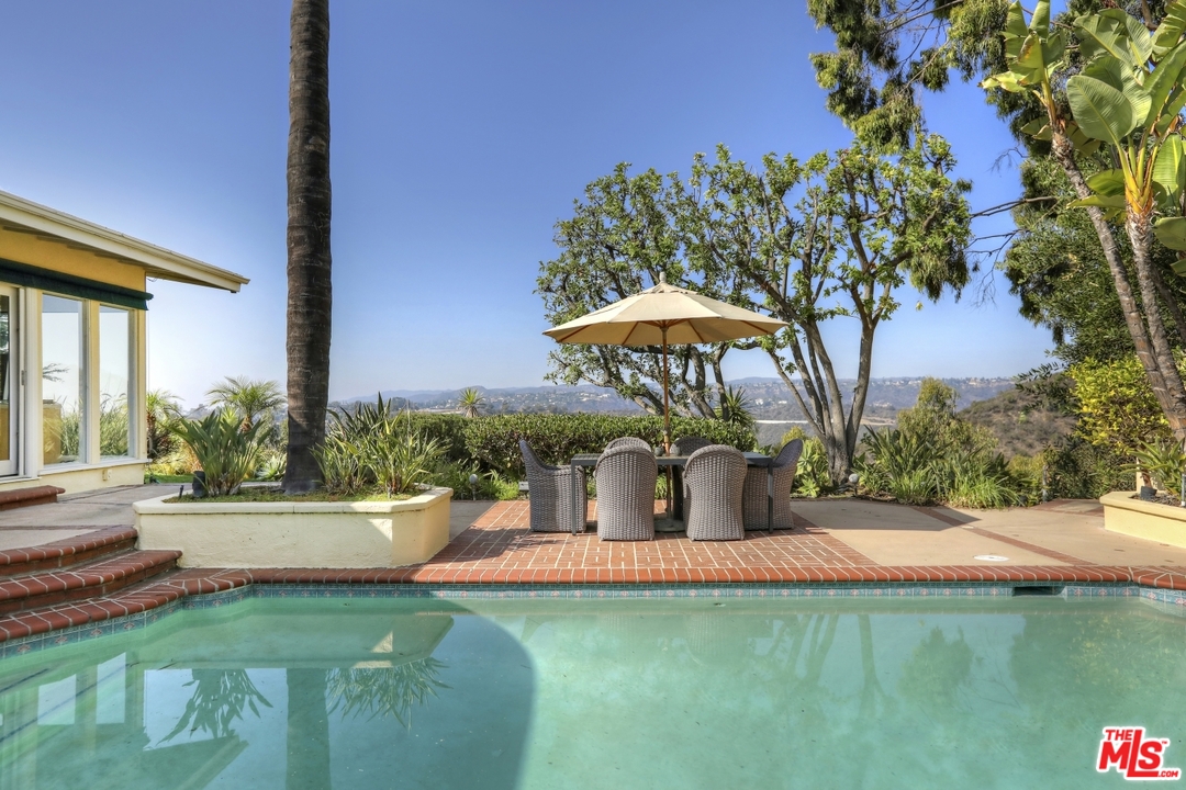 1629 Tower Grove Drive Beverly Hills, CA 90210 - Photo 27 of 29 a view of a house with backyard porch and sitting area