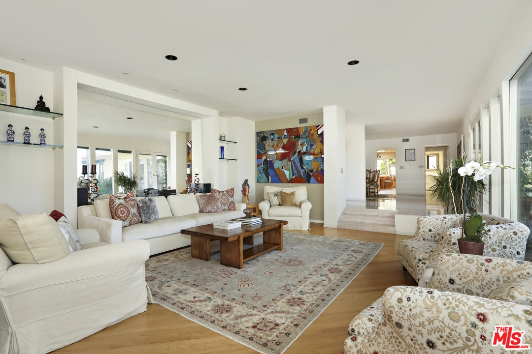 1629 Tower Grove Drive Beverly Hills, CA 90210 - Photo 6 of 29 a living room with furniture and a couch