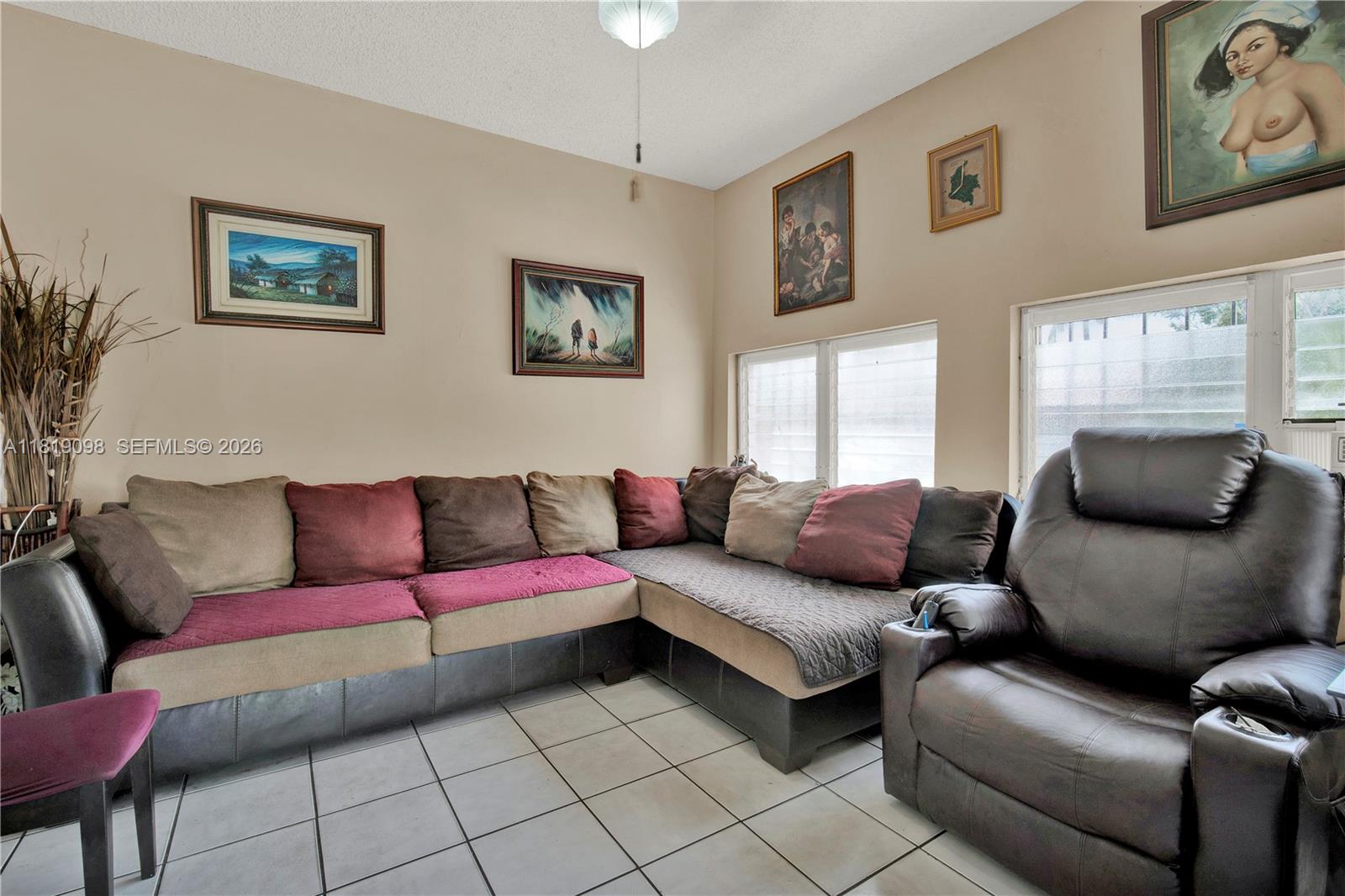 829 Southwest 19th Avenue Miami, FL 33135 - Photo 16 of 54 a living room with furniture and a window