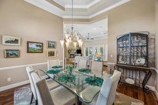 a view of swimming pool with a lounge chairs in a patio