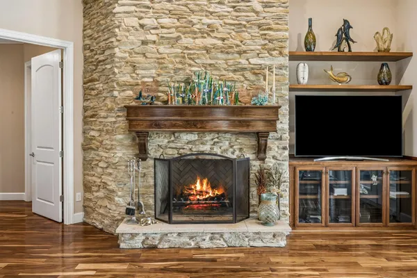 a bathroom with a granite countertop sink a toilet and shower
