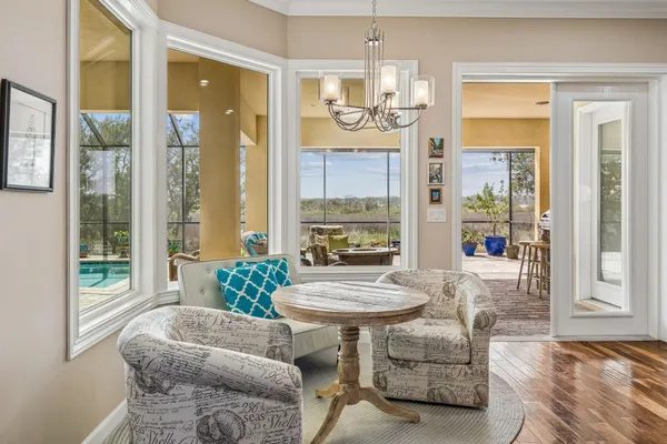 a view of a balcony with wooden floor