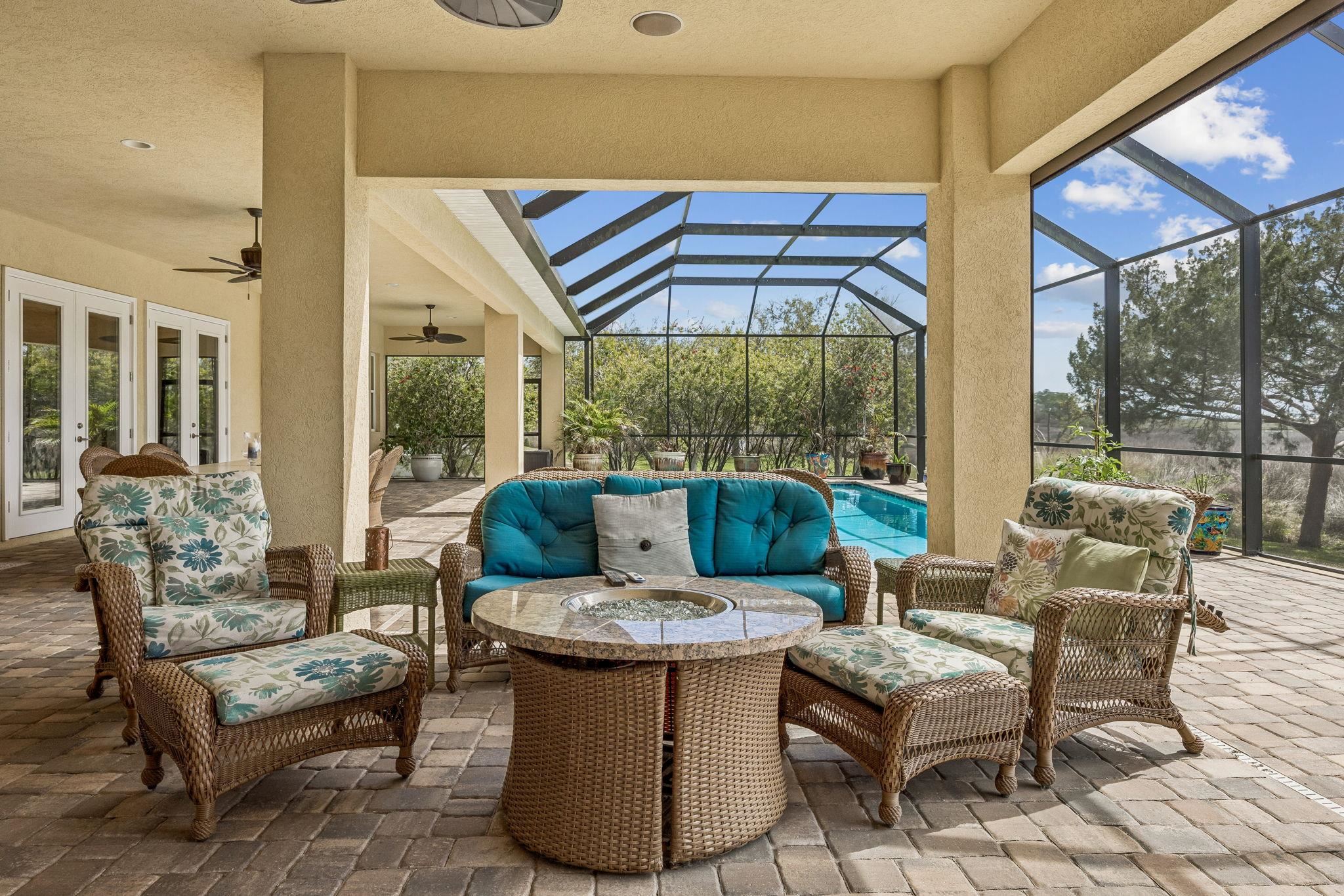 409 Lookout Point Drive St. Augustine, FL 32080 - Photo 32 of 90 a outdoor living space with furniture and garden view