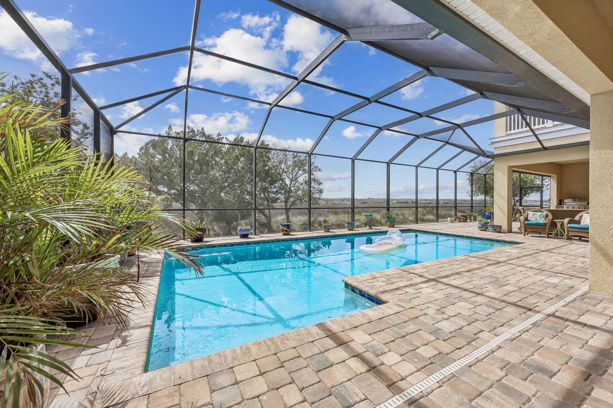 409 Lookout Point Drive St. Augustine, FL 32080 - Photo 38 of 90 a view of a swimming pool with a patio