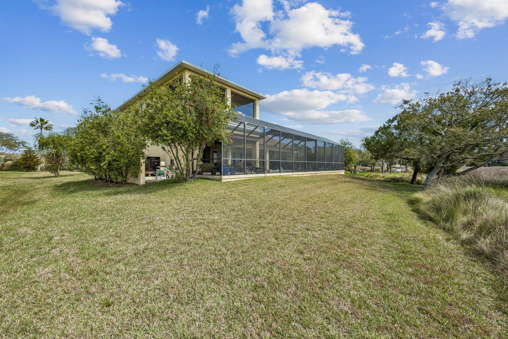 409 Lookout Point Drive St. Augustine, FL 32080 - Photo 40 of 90 a view of a house with a yard